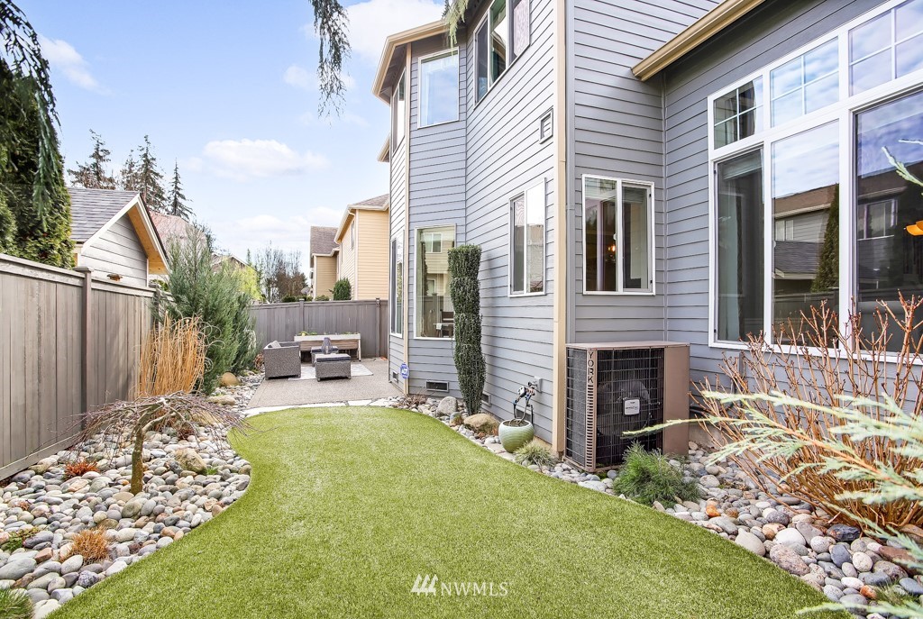 21303 37th Avenue Southeast Bothell, WA 98021 - Photo 30 of 34 a view of a house with backyard and sitting area
