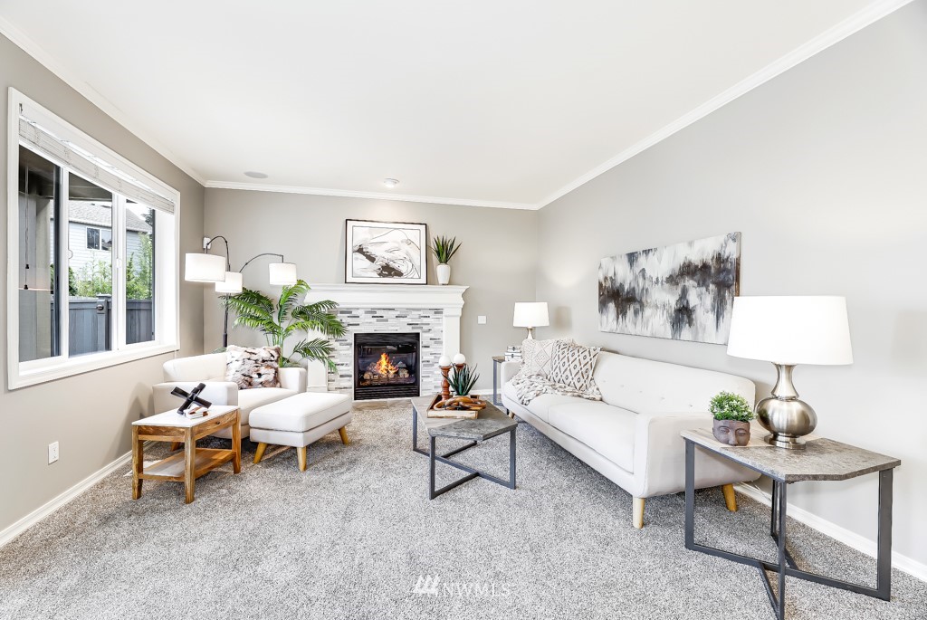 21303 37th Avenue Southeast Bothell, WA 98021 - Photo 8 of 34 a living room with furniture and a fireplace