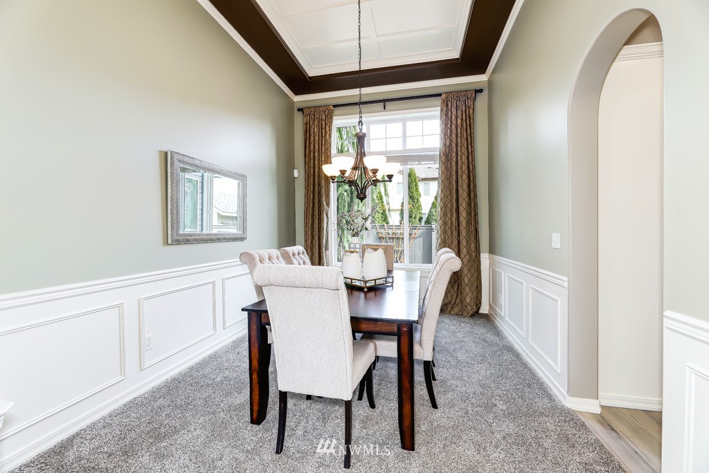 21303 37th Avenue Southeast Bothell, WA 98021 - Photo 10 of 34 a view of a dining room with furniture and a window