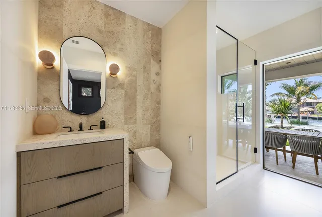 a large bedroom with a large bed and a large window