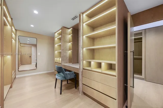 a bedroom with a large bed and a couch