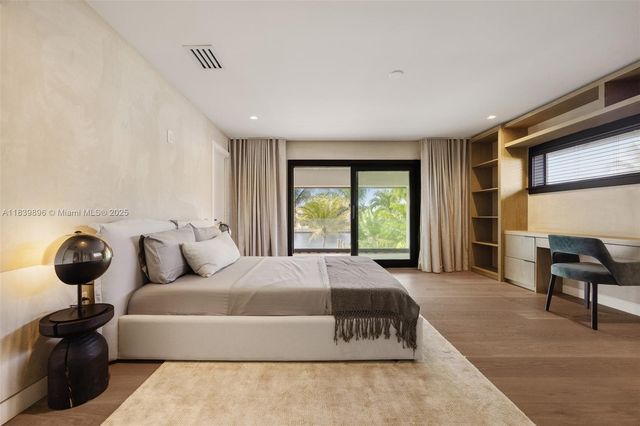 a backyard of a house with large trees