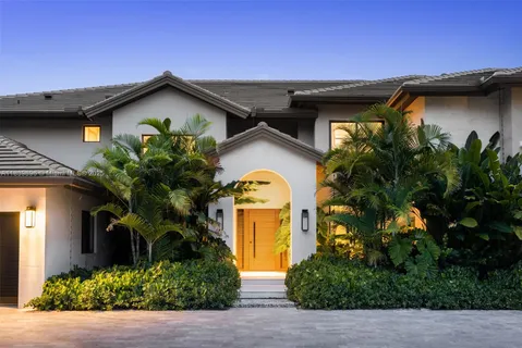 a front view of a house with garden