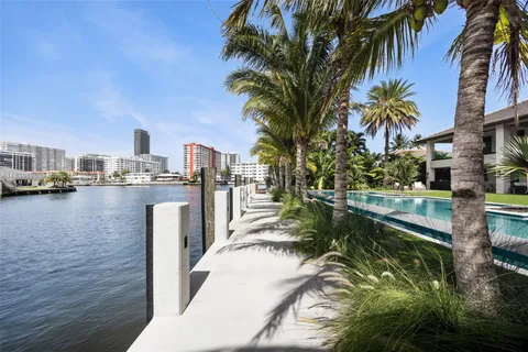 a view of swimming pool with outdoor seating and yard
