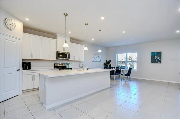 a kitchen with a sink and a refrigerator
