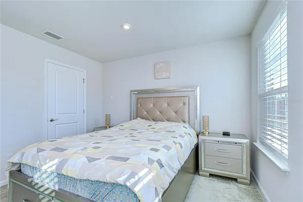 a view of an empty room and a bathroom