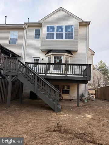 a view of a house with wooden deck