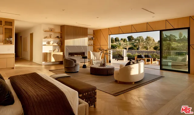 a living room filled with furniture and a large window