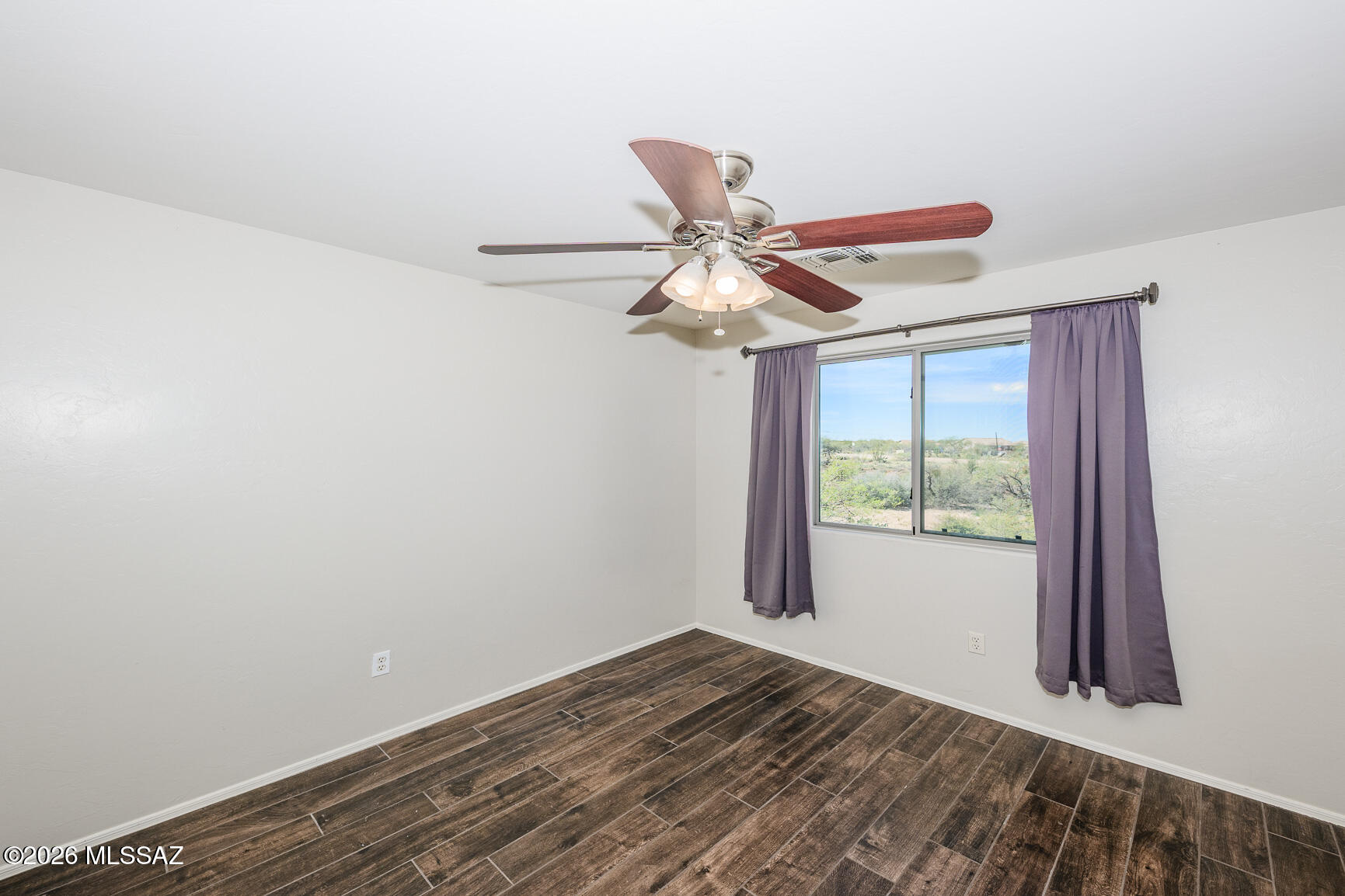 728 South Porter Routh Place Vail, AZ 85641 - Photo 23 of 36 a view of a room with a window and wooden floor
