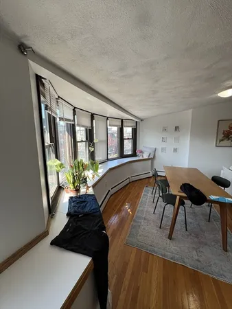 a view of a living room and dining room