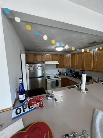 a kitchen with table and chairs