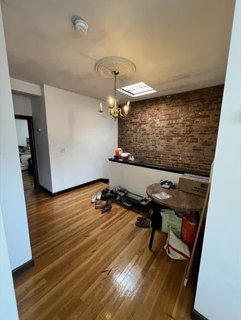 a room with wooden floor and furniture