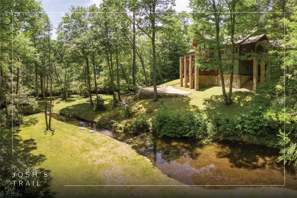 a backyard of a house with lots of green space