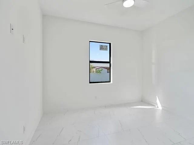 a white toilet sitting next to a bath tub