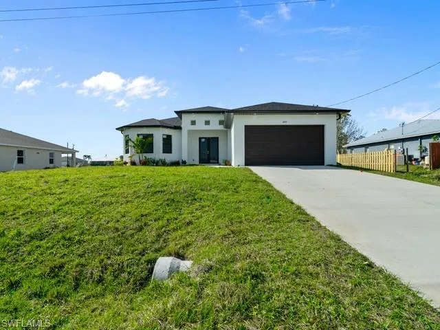 a front view of a house with a yard