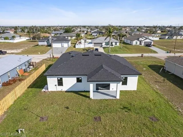 an aerial view of a house with a ocean view
