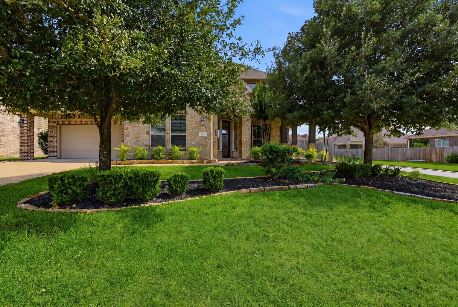 6835 Preston Grove Drive Spring, TX 77389 - Photo 1 of 49 a front view of a house with a garden and tree