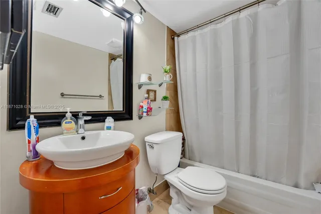 a bathroom with a toilet and a sink