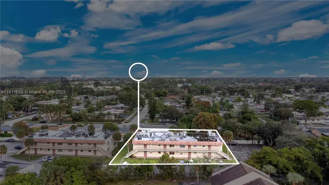 an aerial view of a residential houses with outdoor space