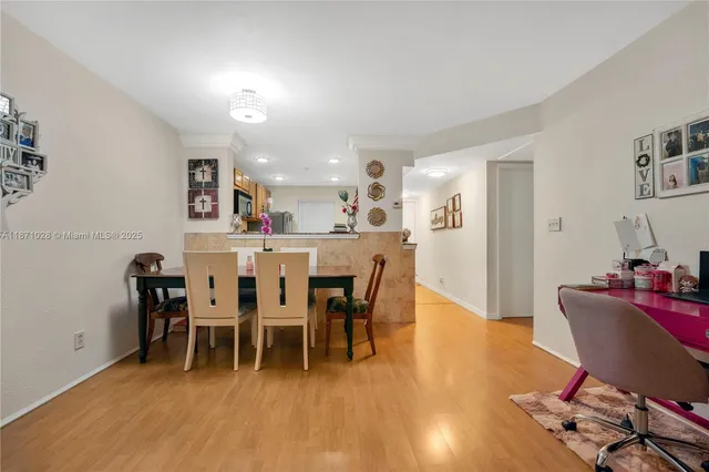 a view of a dining room with furniture and wooden floor
