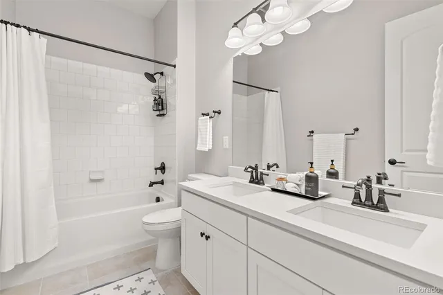 a utility room with sink dryer and washer