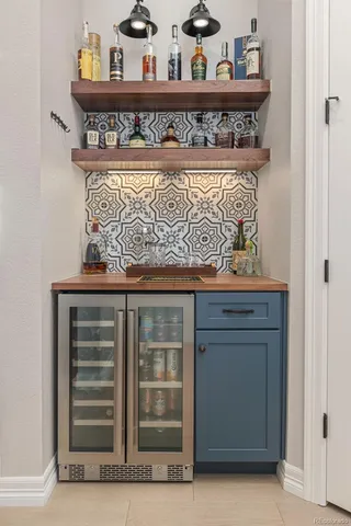 a view of a livingroom with workspace and a window