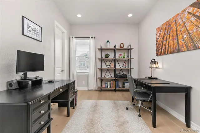 a view of a dining room with furniture and window