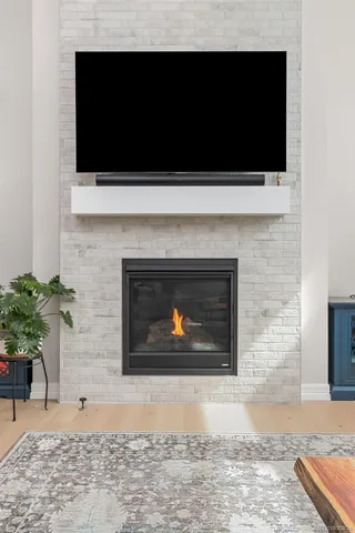 a view of a dining room with furniture and a window