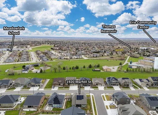 a backyard with table & chairs and wooden floor