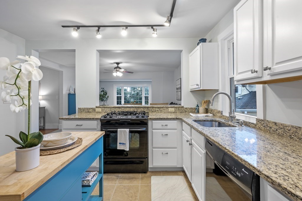 18 King Street, Unit 1 Swampscott, MA 01907 - Photo 15 of 27 a kitchen with stainless steel appliances a sink a stove and cabinets