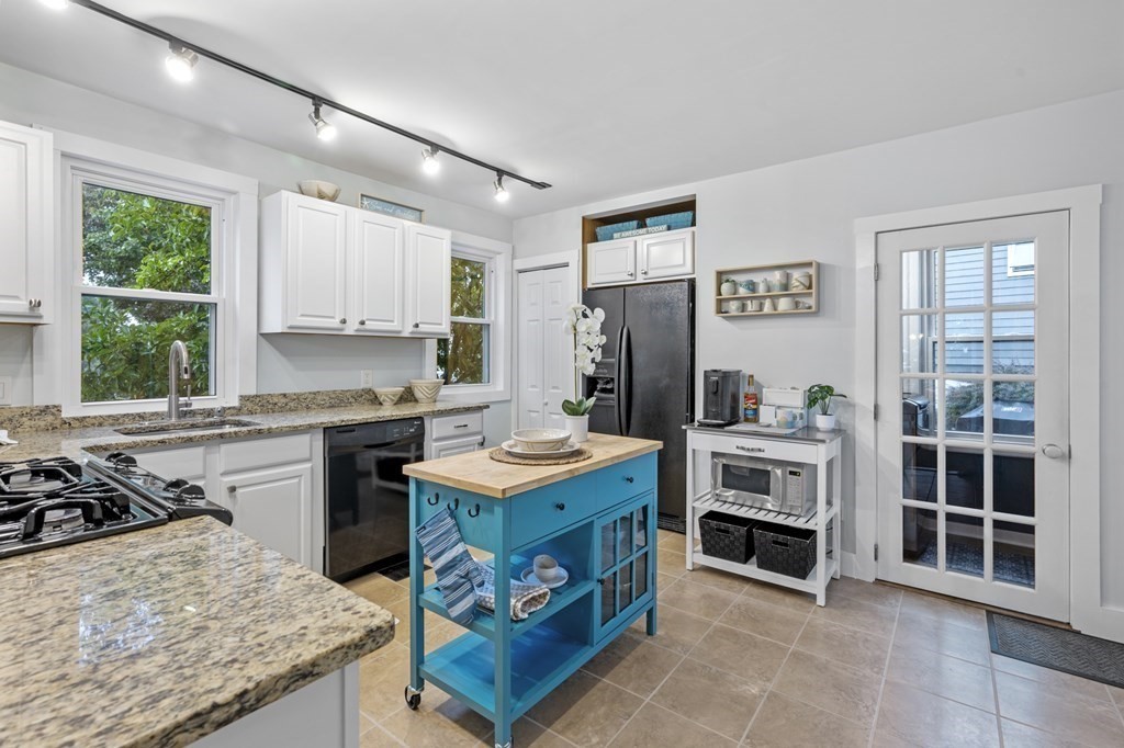 18 King Street, Unit 1 Swampscott, MA 01907 - Photo 16 of 27 a kitchen with a stove a refrigerator and a stove top oven