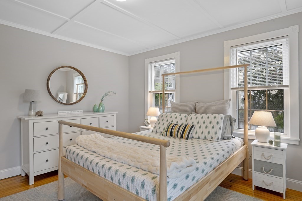 18 King Street, Unit 1 Swampscott, MA 01907 - Photo 20 of 27 a bedroom with a bed and a dresser