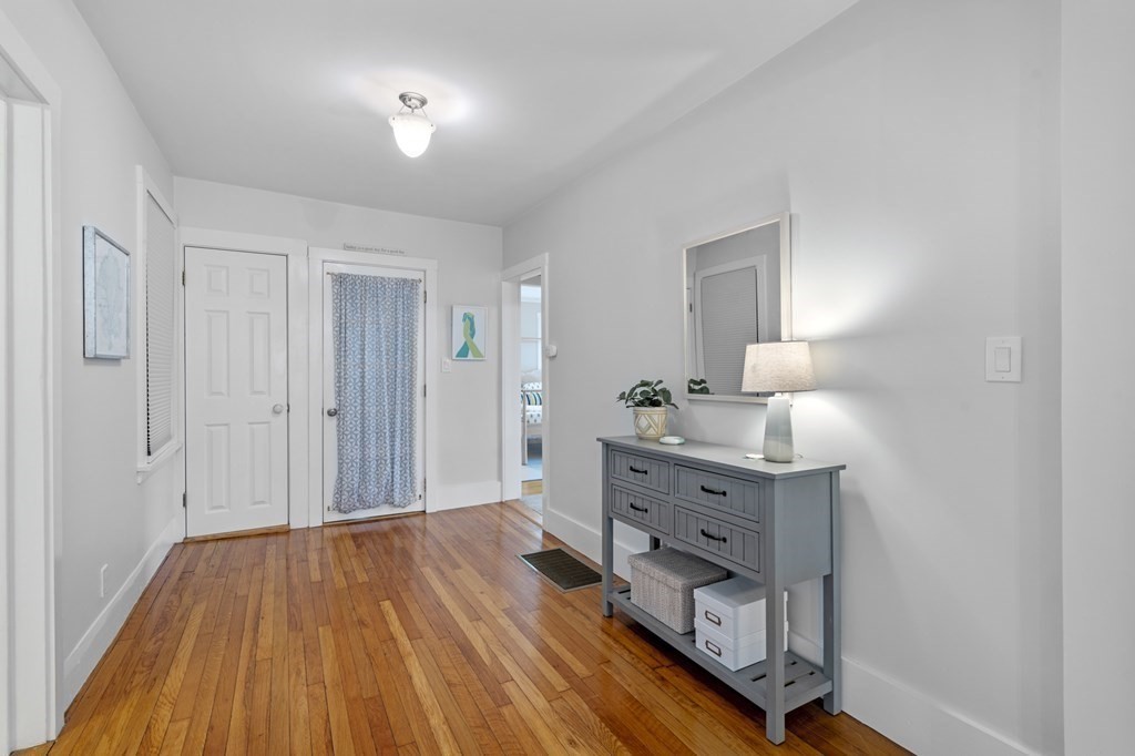 18 King Street, Unit 1 Swampscott, MA 01907 - Photo 5 of 27 a room with a bed and a dresser