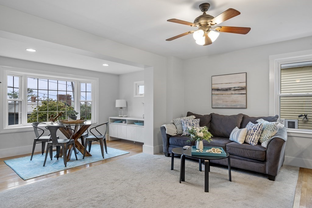 18 King Street, Unit 1 Swampscott, MA 01907 - Photo 6 of 27 a living room with furniture a dining table and a potted plant