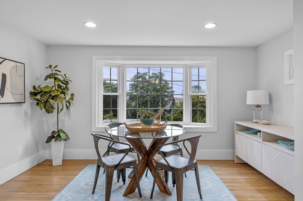 18 King Street, Unit 1 Swampscott, MA 01907 - Photo 9 of 27 a view of a dining room with furniture window and wooden floor