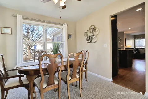 a view of a dining room with furniture window and outside view