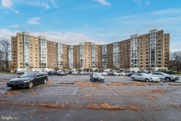 a city view with tall buildings and a large parking space