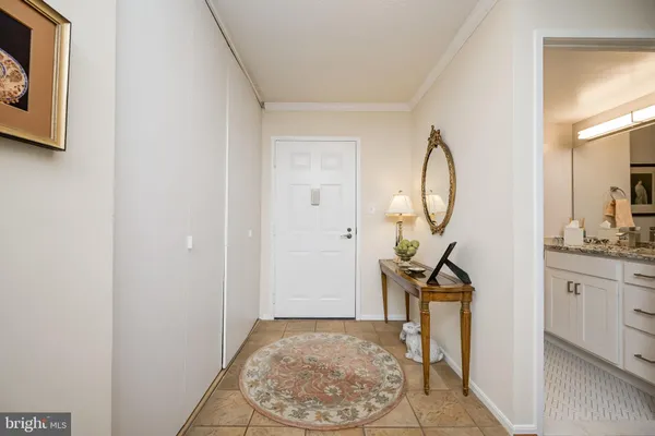 a view of a livingroom with wooden floor and entryway