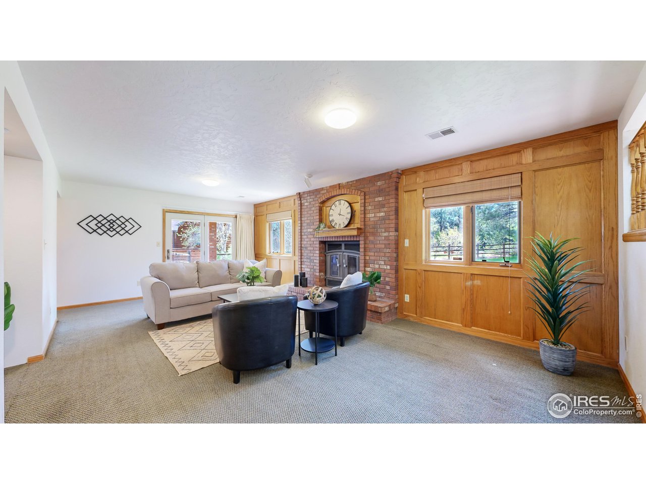 2217 Brixton Road Fort Collins, CO 80526 - Photo 13 of 28 Family room with cozy wood burning fireplace