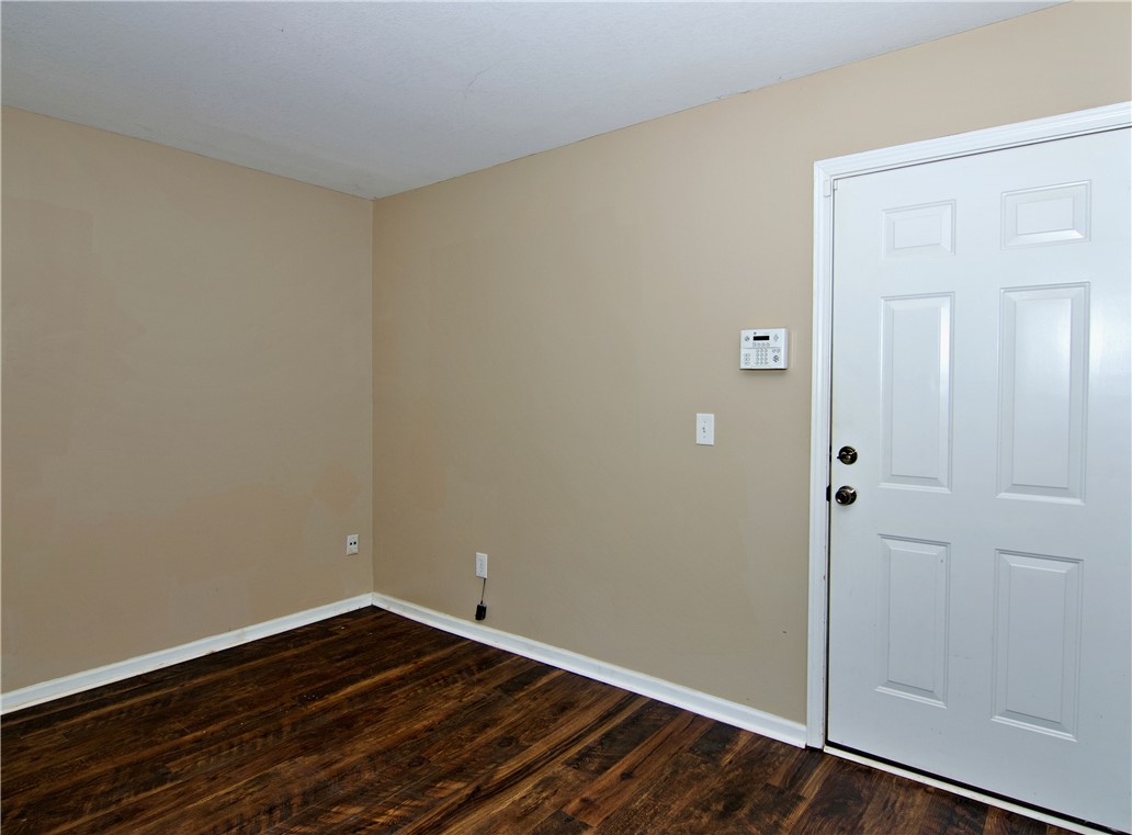 305 North Chestnut Street Seneca, SC 29678 - Photo 18 of 44 Secure entry and rich wood flooring welcome you into this inviting interior.