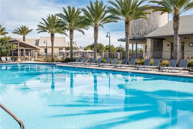 a dining table with chairs and palm tree
