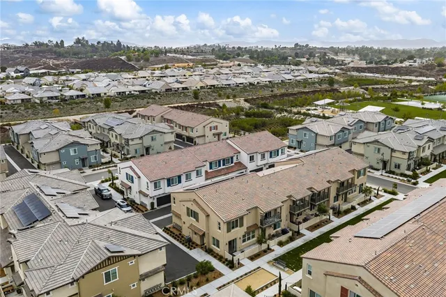 an aerial view of a city with ocean view