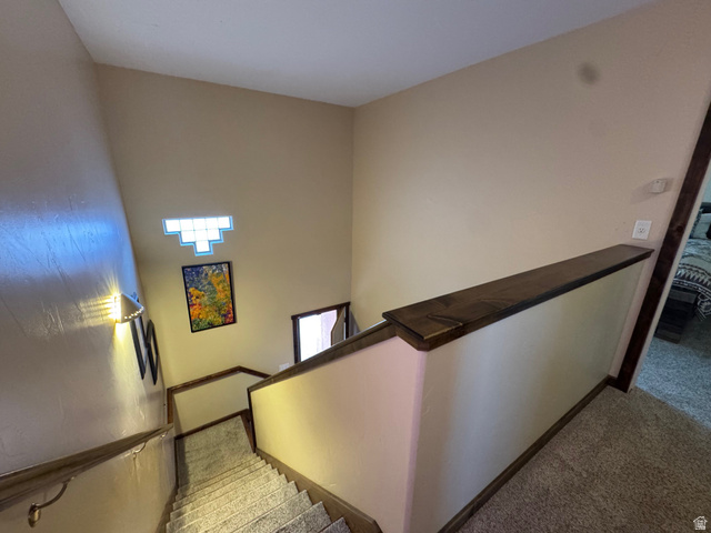 3439 Westwater Road Moab, UT 84532 - Photo 44 of 64 Stairs featuring carpet floors