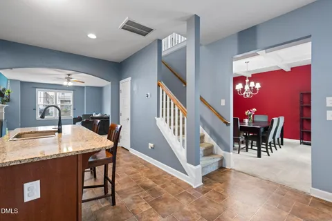 a dining room with furniture and entryway