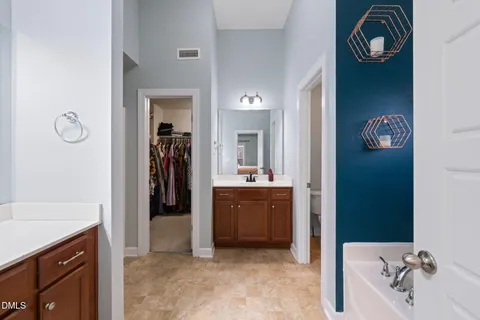 a bathroom with a bathtub and a sink