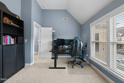 a view of workspace with lounge chair windows