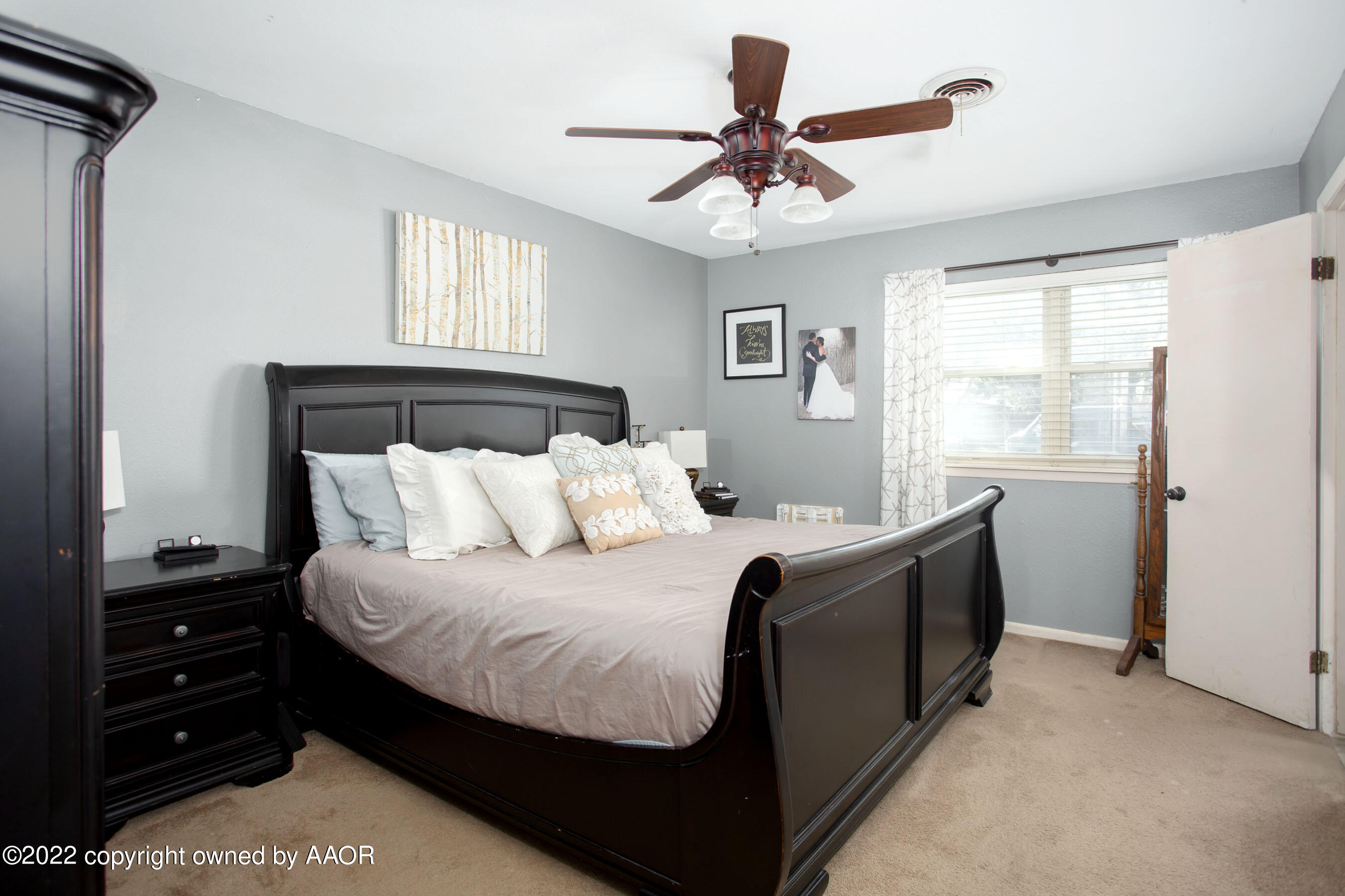 7214 Jameson Road Amarillo, TX 79106 - Photo 19 of 31 a bedroom with a bed and a window