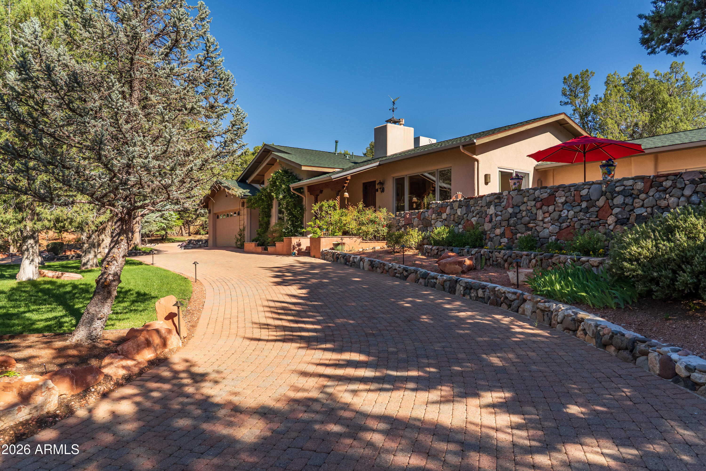 190 Morgan Road Sedona, AZ 86336 - Photo 12 of 51 a front view of a house with a yard