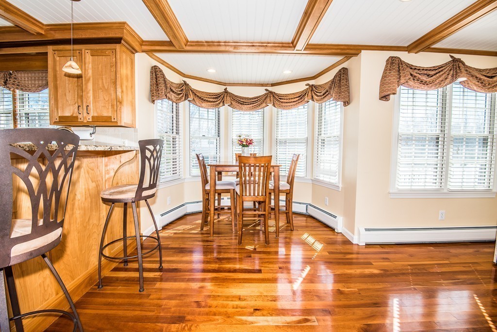5 Twin Brooks Road Salisbury, MA 01952 - Photo 11 of 30 a dining room with wooden floor table and chairs