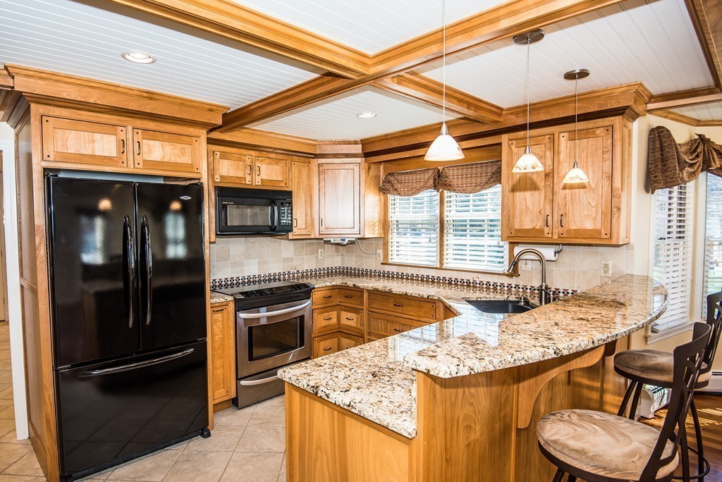 5 Twin Brooks Road Salisbury, MA 01952 - Photo 12 of 30 a kitchen with a sink stove and refrigerator